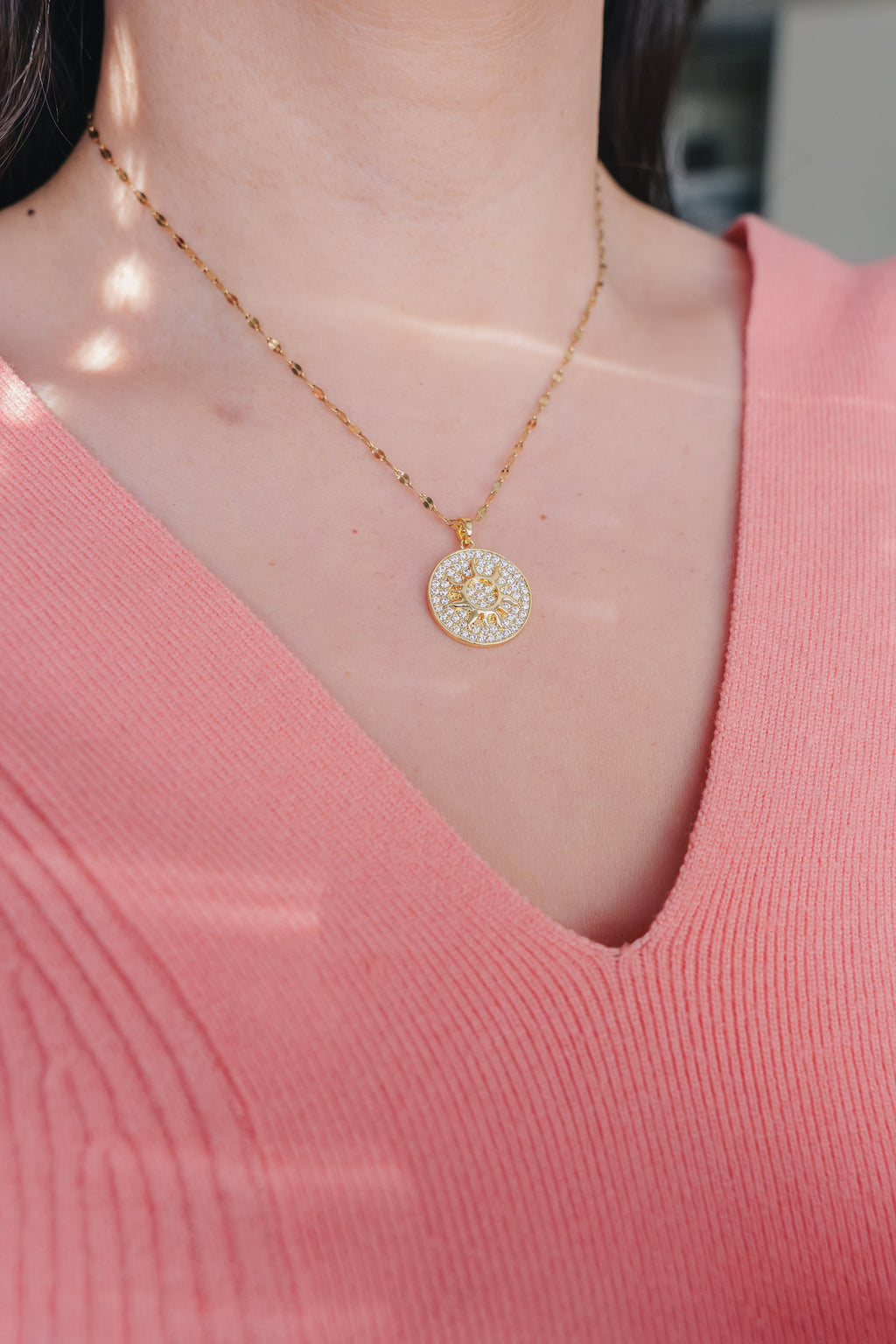 Inner Sparkle Necklace – Gold Sunburst Pendant with CZ Crystals (16” + Extender)