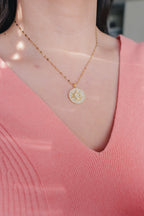 Inner Sparkle Necklace – Gold Sunburst Pendant with CZ Crystals (16” + Extender)