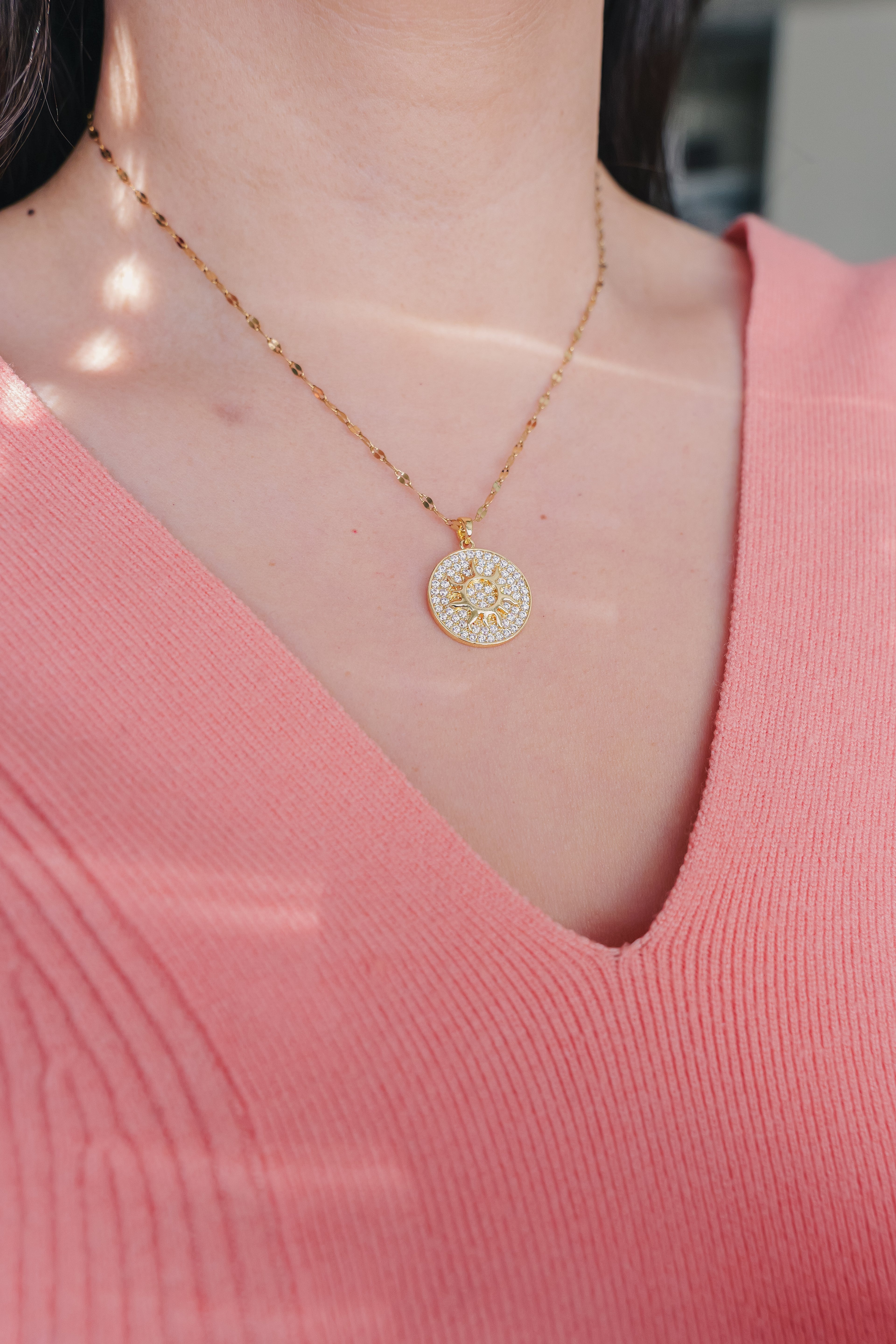 Inner Sparkle Necklace – Gold Sunburst Pendant with CZ Crystals (16” + Extender)