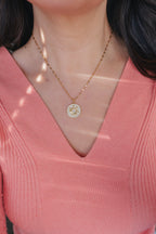 Inner Sparkle Necklace – Gold Sunburst Pendant with CZ Crystals (16” + Extender)