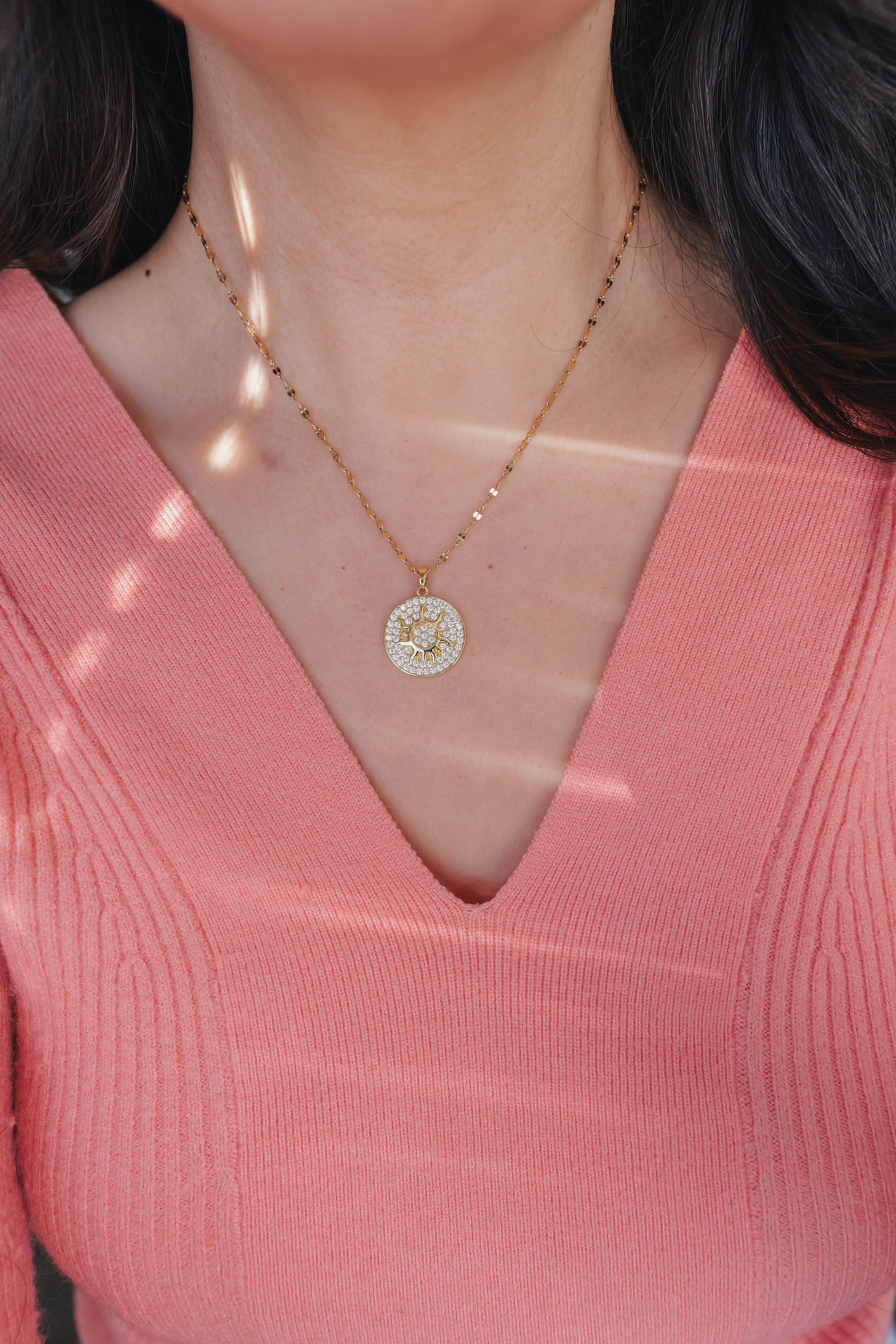 Inner Sparkle Necklace – Gold Sunburst Pendant with CZ Crystals (16” + Extender)