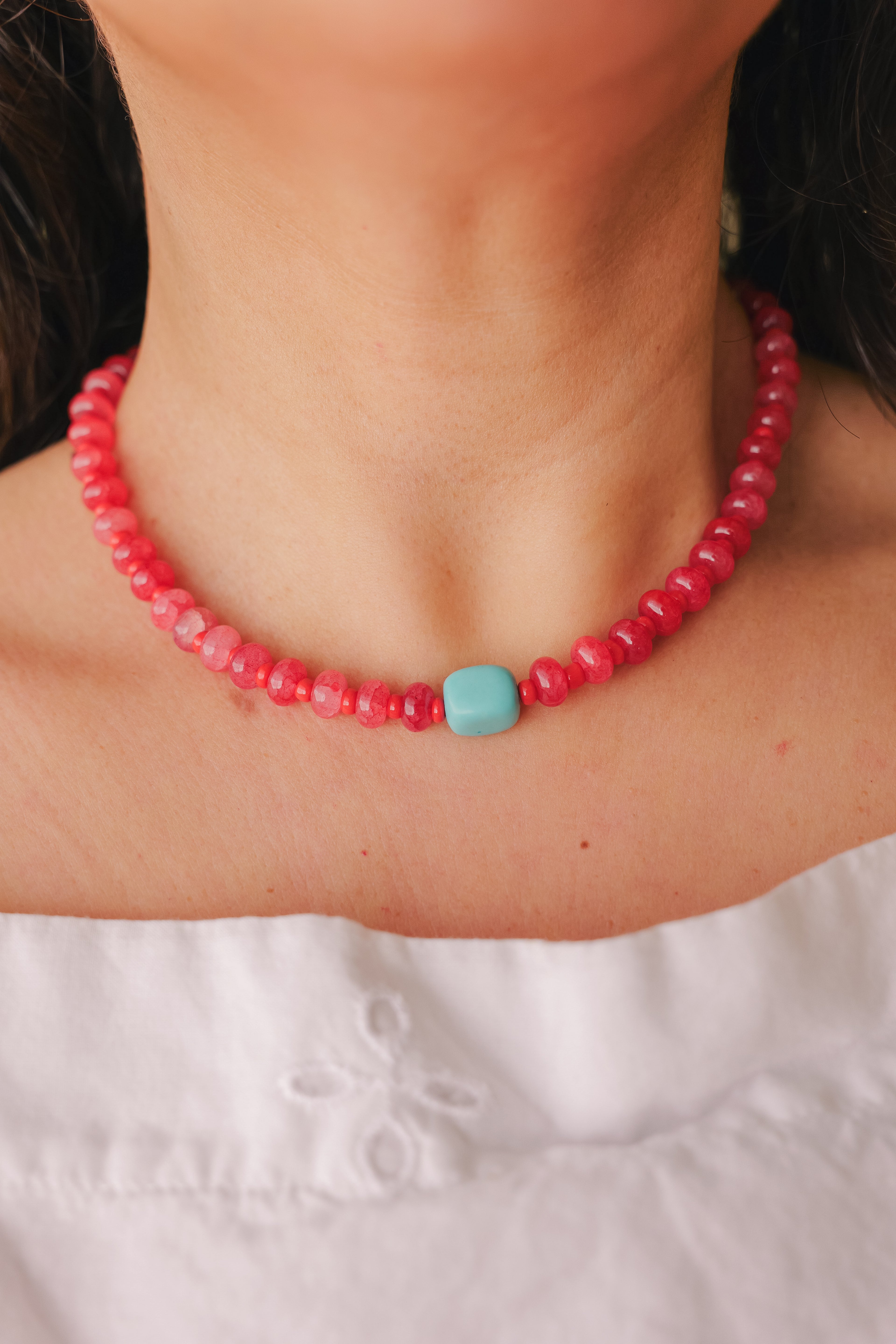 Red beaded necklace with turquoise stone