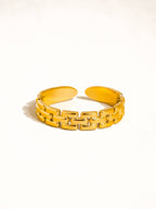 Yellow chain-link bracelet on a white background
