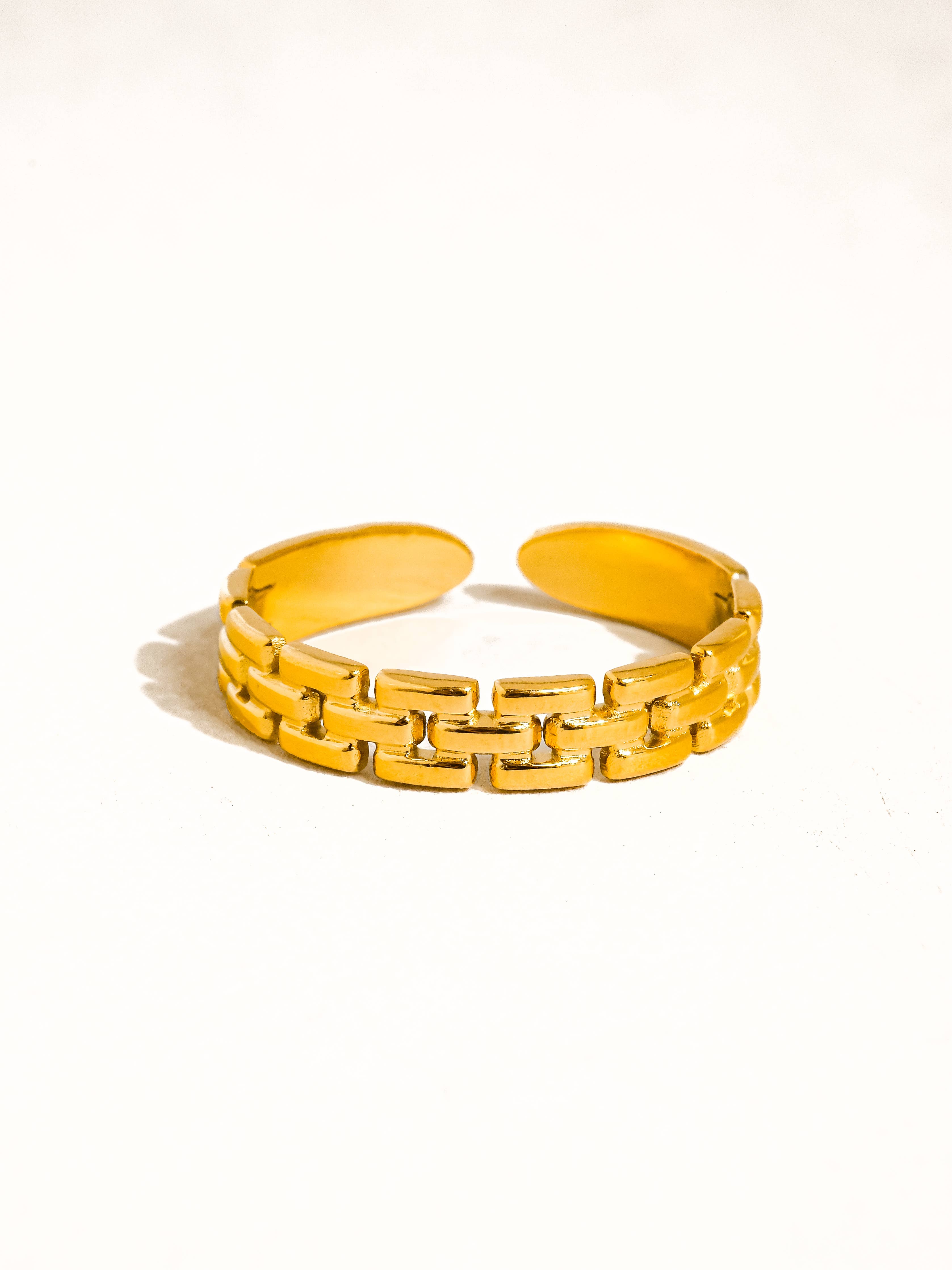 Yellow chain-link bracelet on a white background