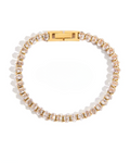 Bracelet with gold and clear beads on a white background