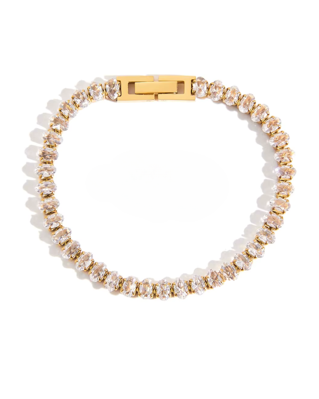 Bracelet with gold and clear beads on a white background