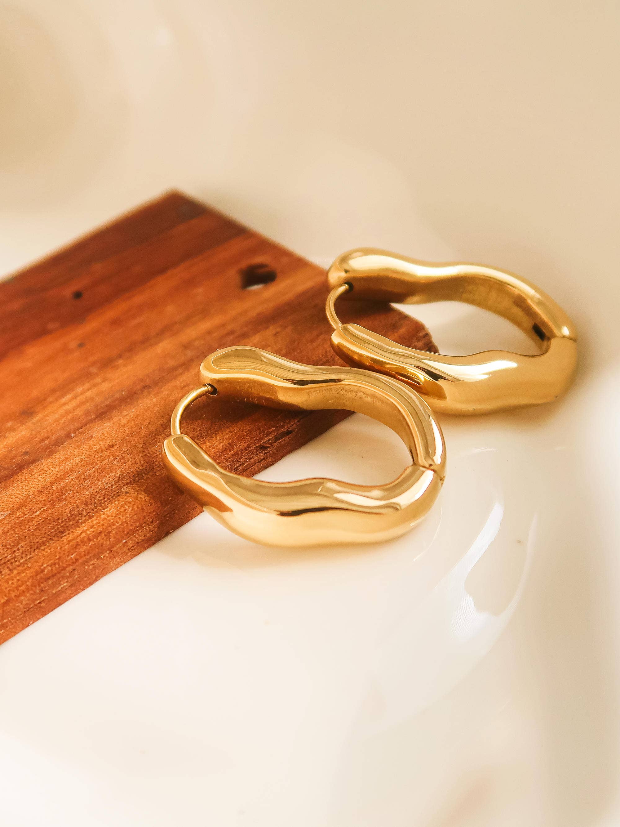 gold wavy hoops