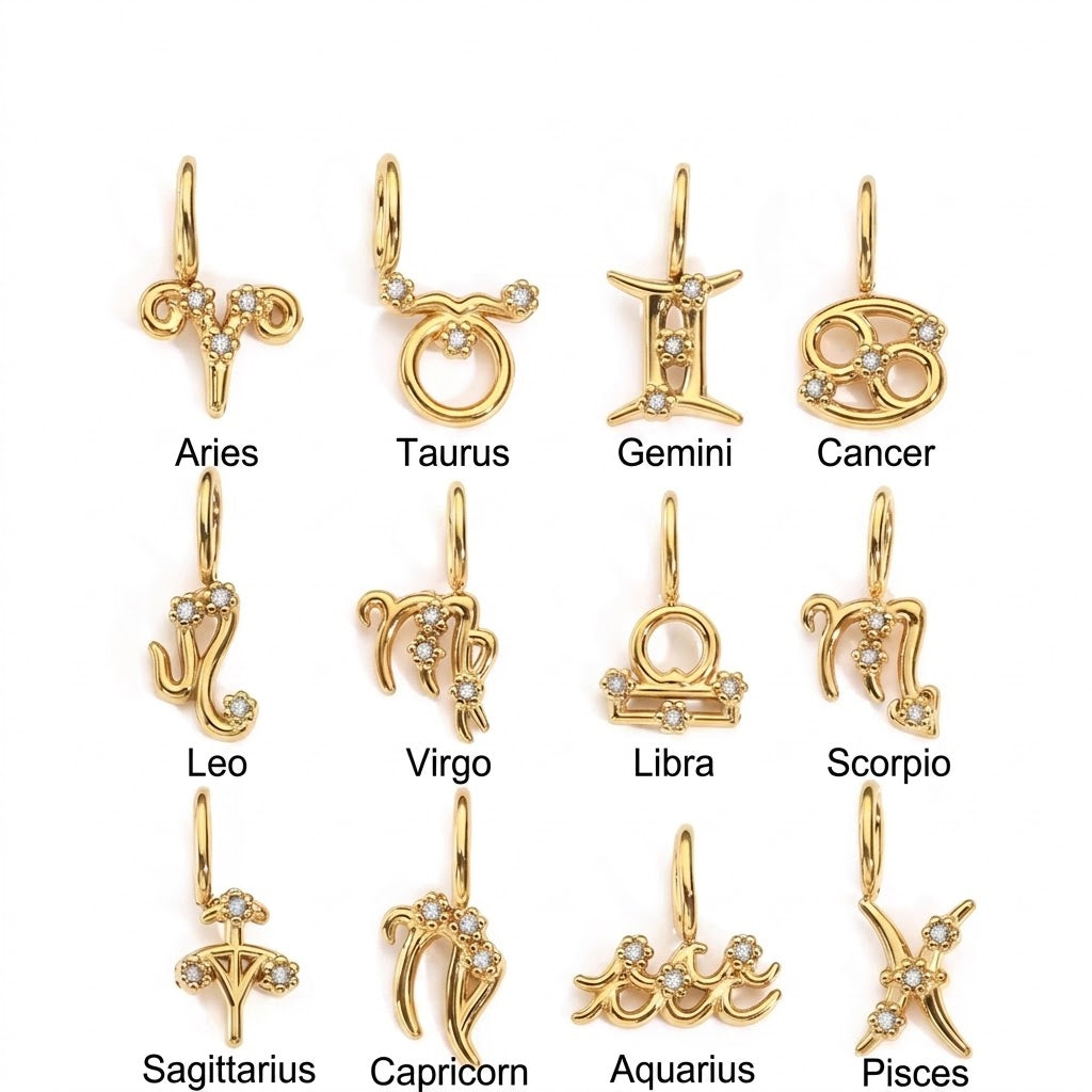 Tarnish-free gold zodiac charms, stud earrings, and box chain necklace arranged on a green heart tray — Ligisol stainless steel jewelry